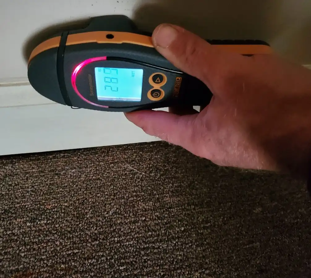 Moisture detection at baseboard during Storm Damage Restoration in Germantown